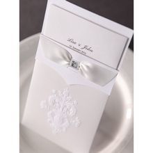 Top view of the rectangular damask invitation featuring white insert; embossed cover and three panel inner card